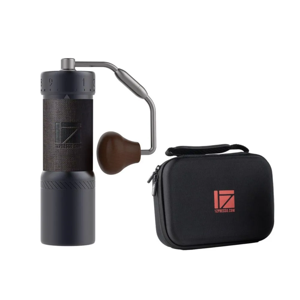 Dark gray 1Zpresso J-Ultra espresso hand grinder beside its black zippered carrying case