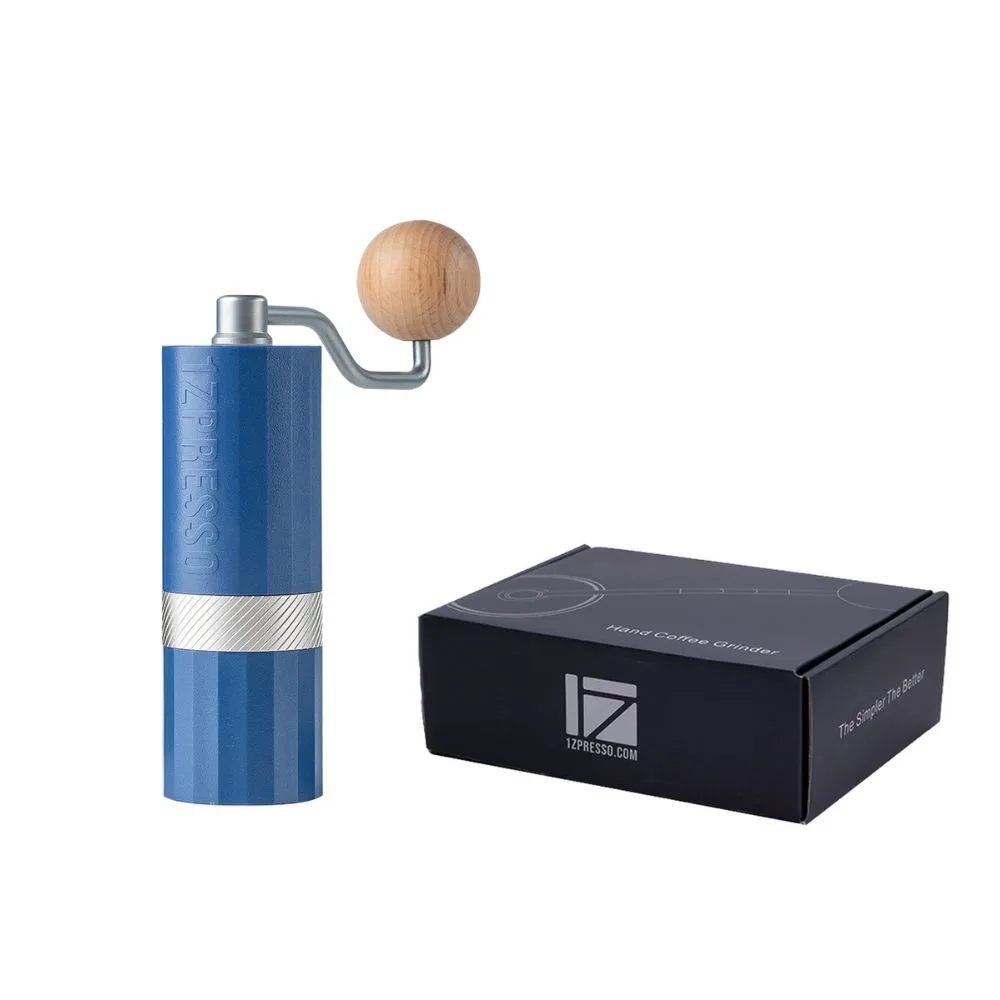 Blue 1Zpresso Q Air hand grinder with a wooden handle knob beside its retail box