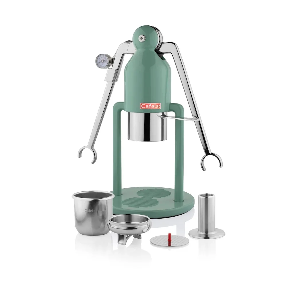 Green Cafelat Robot Barista with two lever arms and a pressure gauge, beside its basket, portafilter, screen and tamper