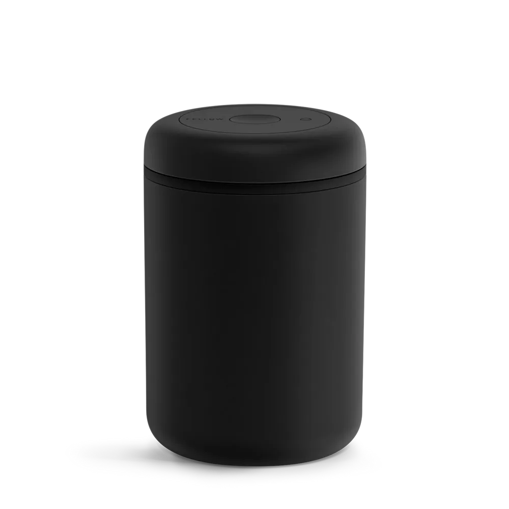 Matte-black Fellow Manual Atmos 1.2 L canister with its twist-operated vacuum lid