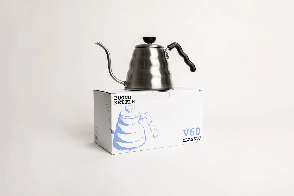 Silver Hario V60 Buono stovetop gooseneck kettle with a black handle, displayed on its retail box