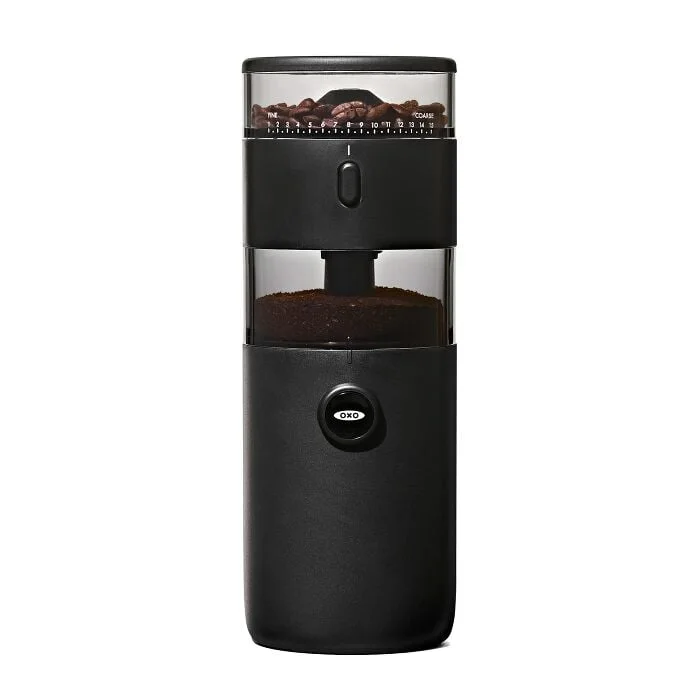 Black OXO Compact Conical Burr Coffee Grinder with its stacked bean and grounds containers