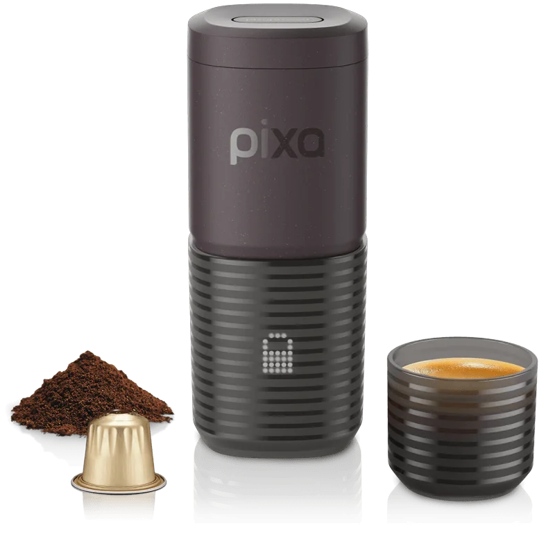 Dark burgundy Wacaco Pixapresso with its display, a cup of espresso, ground coffee and a capsule